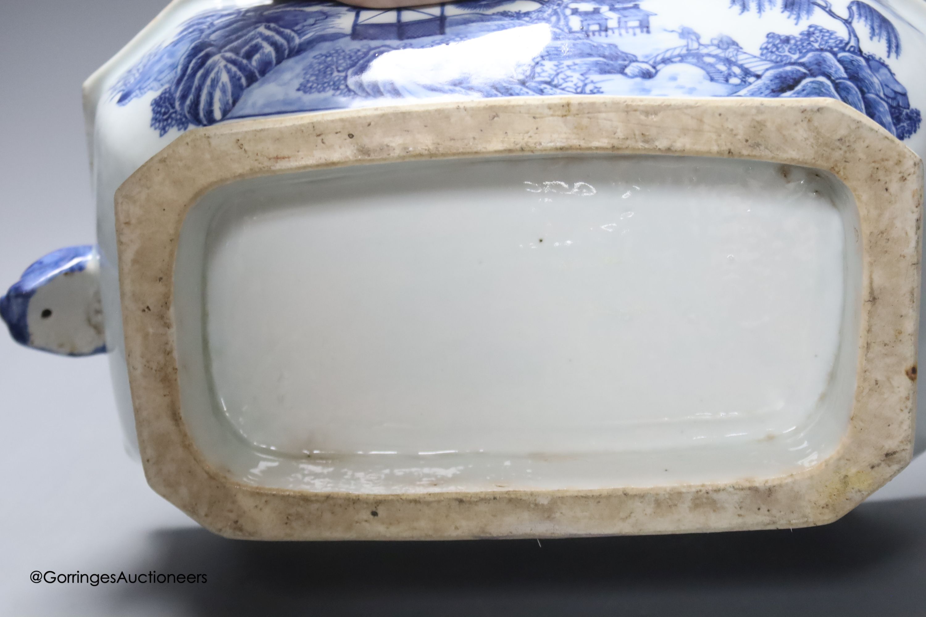 Two 18th century Chinese export blue and white lidded tureens, one lacking cover, 34cm